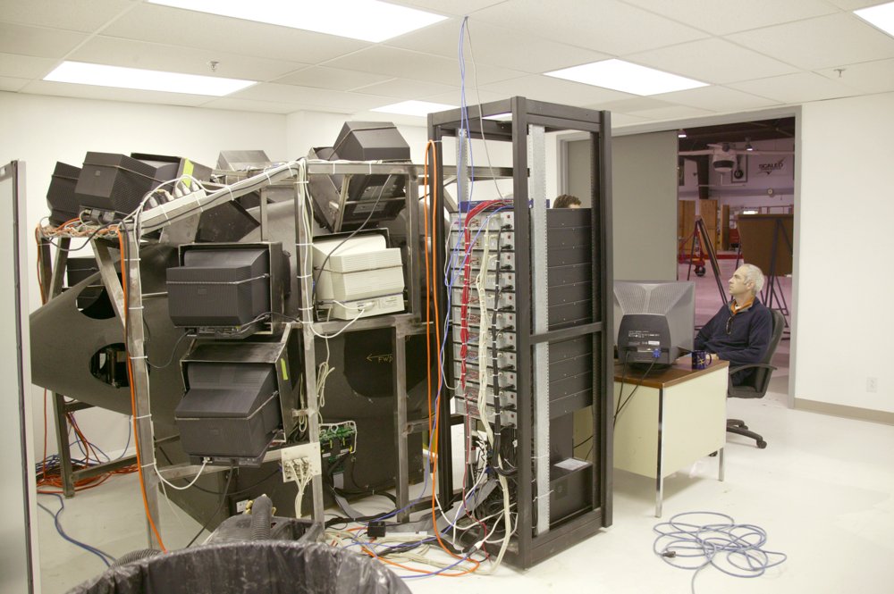 The SpaceShipOne simulator under construction, wired to a rack of computers