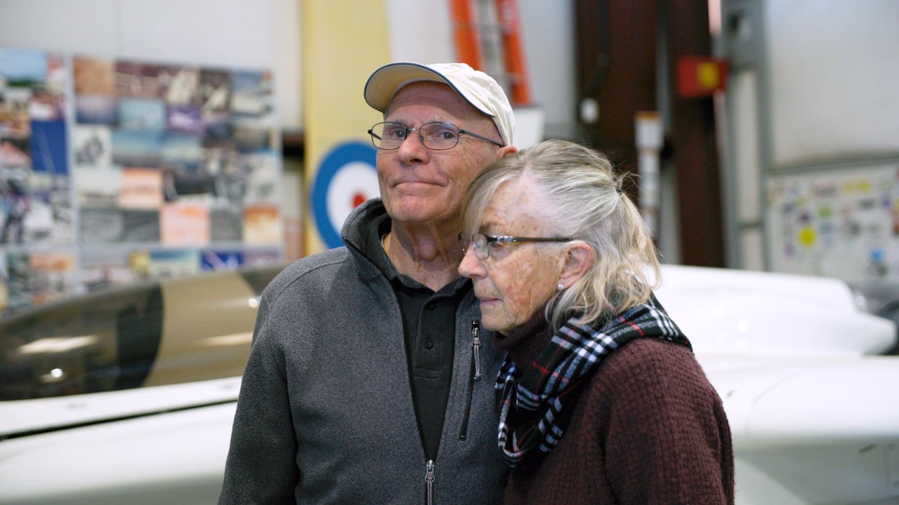 Sally and Mike Melvill stand together in a hangar