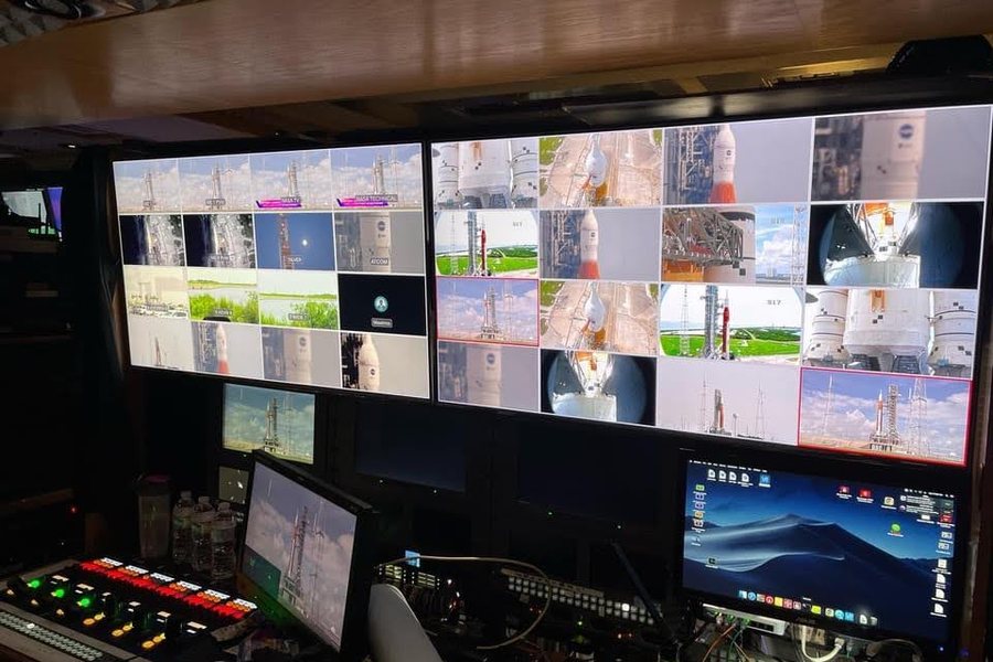 Broadcast control room with a wall of monitors